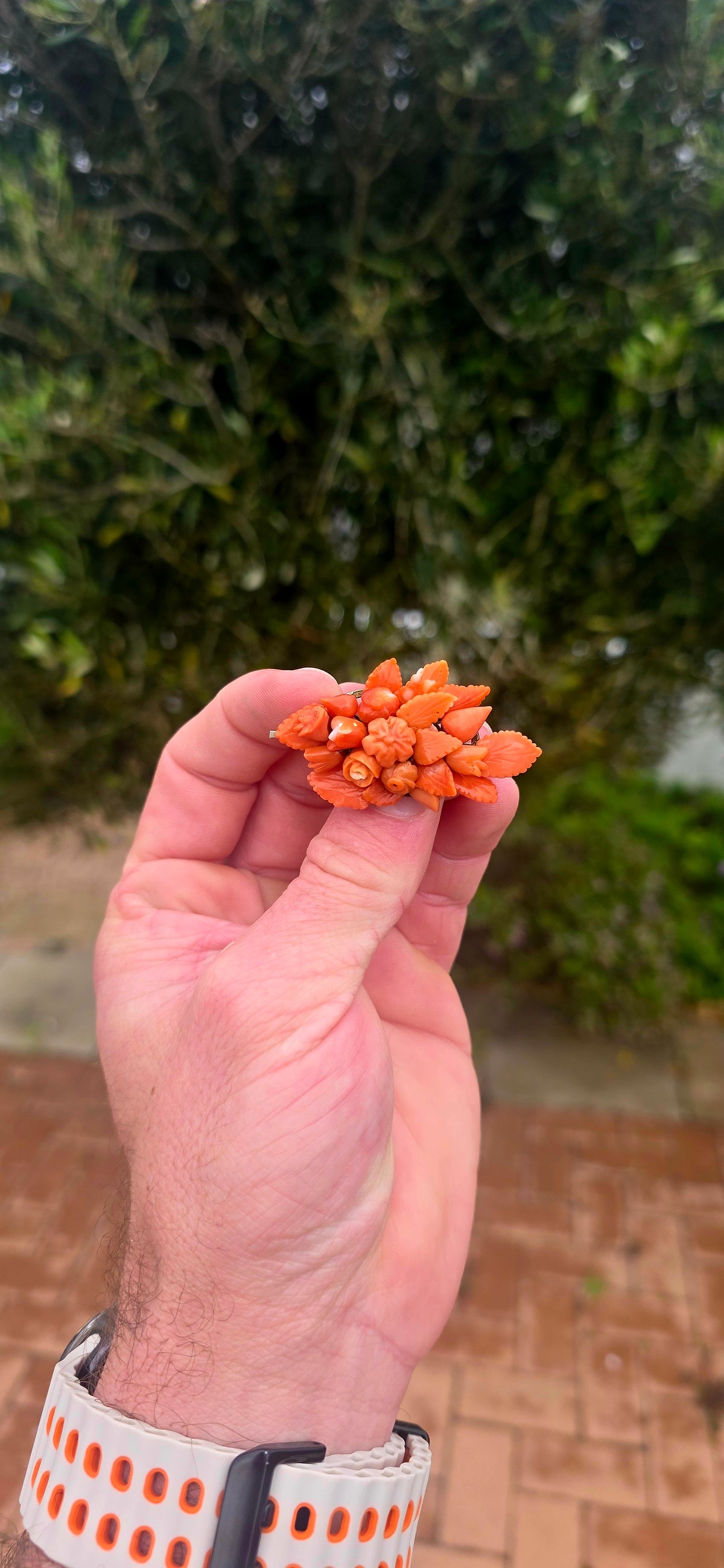 A magnificent antique Victorian-era sterling silver and hand-carved coral bouquet brooch, featuring the most delightful three-dimensional arrangement of miniature flowers, rosebuds and beautifully detailed leaves!
