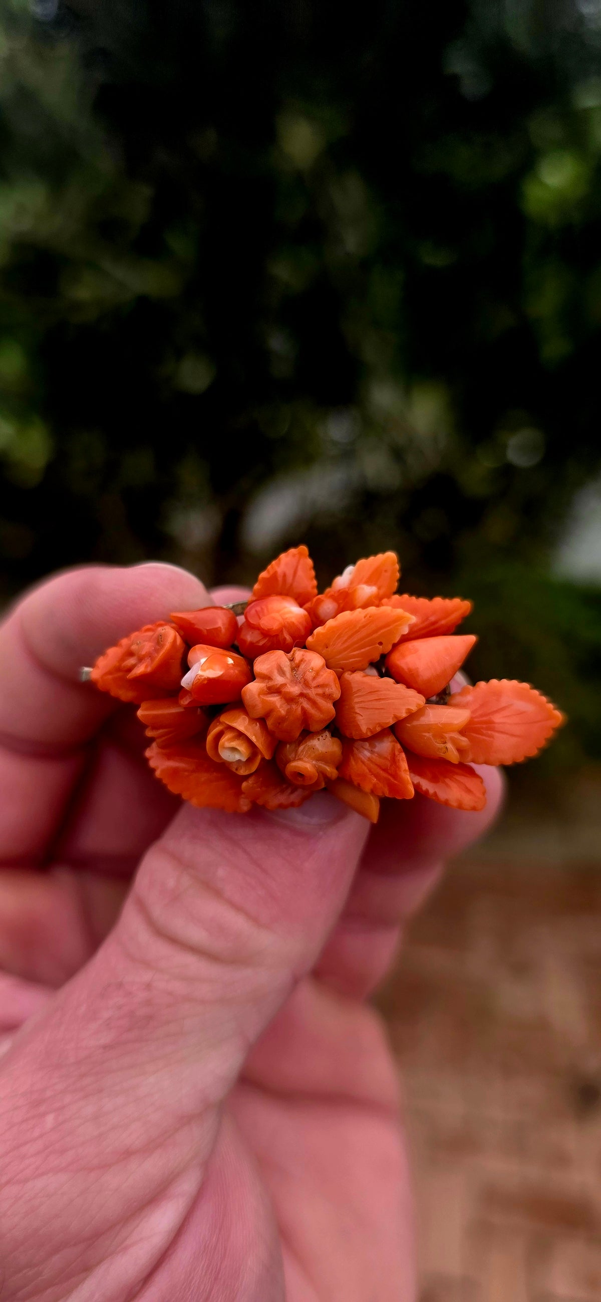 A magnificent antique Victorian-era sterling silver and hand-carved coral bouquet brooch, featuring the most delightful three-dimensional arrangement of miniature flowers, rosebuds and beautifully detailed leaves!