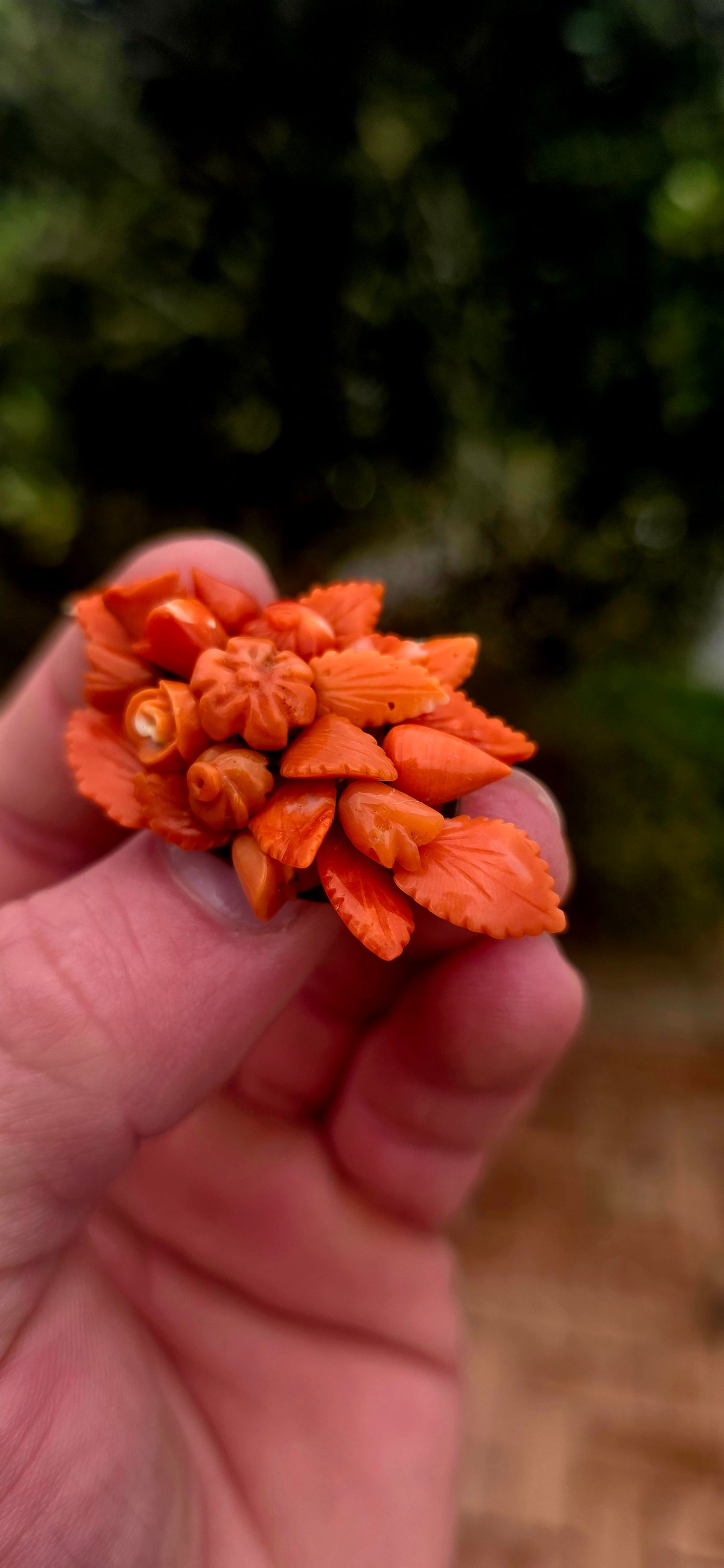 A magnificent antique Victorian-era sterling silver and hand-carved coral bouquet brooch, featuring the most delightful three-dimensional arrangement of miniature flowers, rosebuds and beautifully detailed leaves!