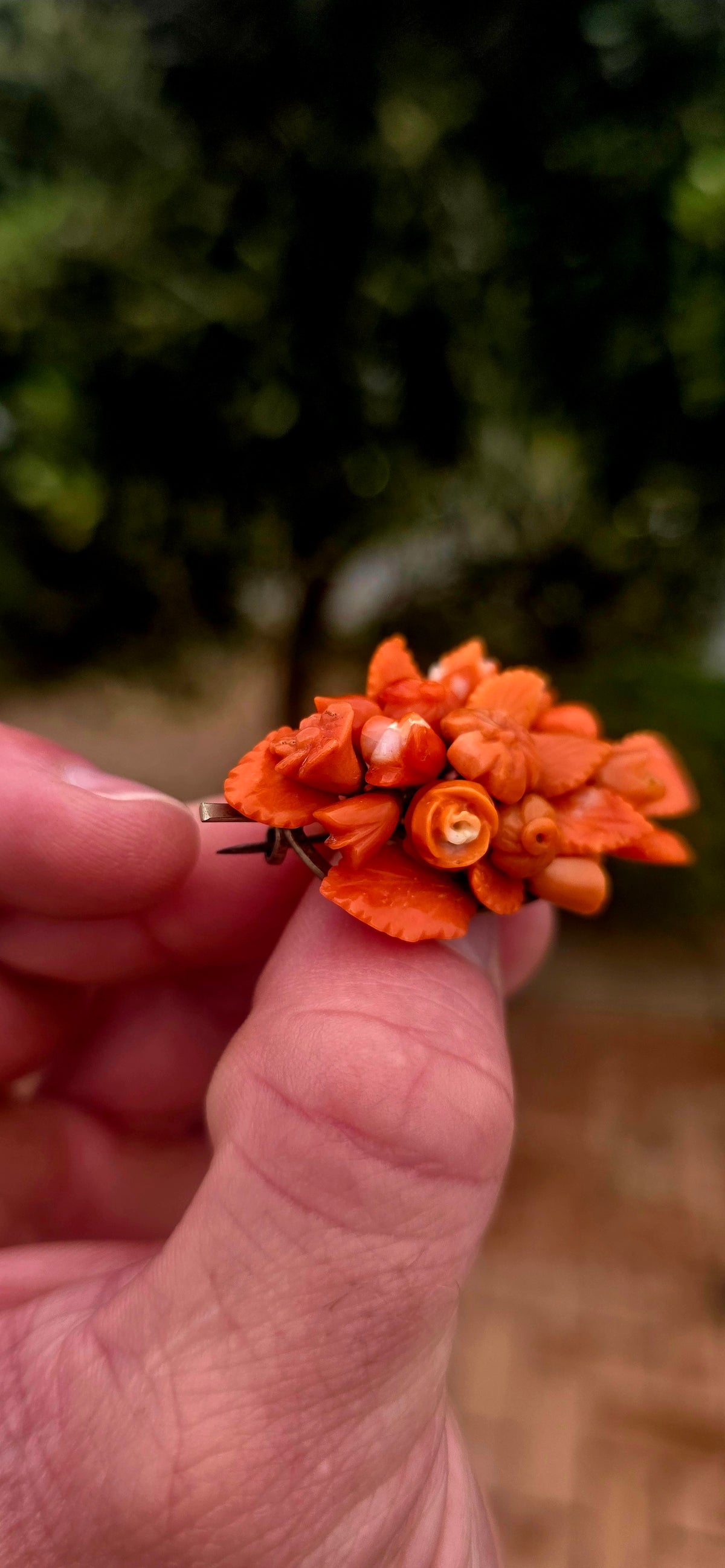 A magnificent antique Victorian-era sterling silver and hand-carved coral bouquet brooch, featuring the most delightful three-dimensional arrangement of miniature flowers, rosebuds and beautifully detailed leaves!
