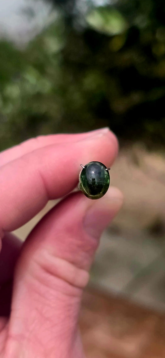 An absolutely BEAUTIFUL unset chrome green tourmaline cabochon, displaying the most enchanting deep forest-green colour with gorgeous flashes of vivid emerald green as the light catches it!