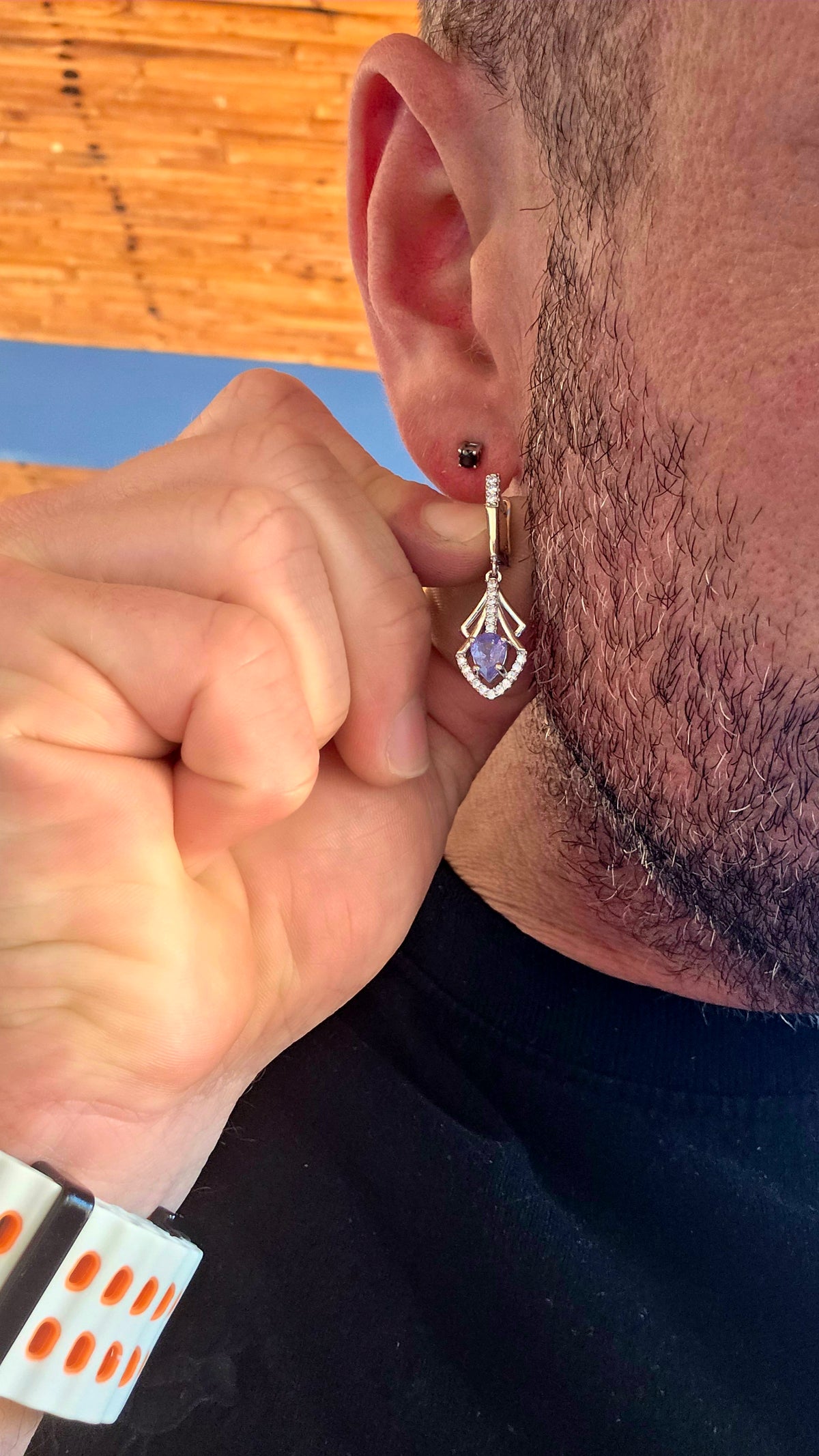 A beautifully elegant pair of Art Deco revival sterling silver drop earrings, featuring enchanting violet-blue tanzanites complemented by sparkling cubic zirconia gemstones!