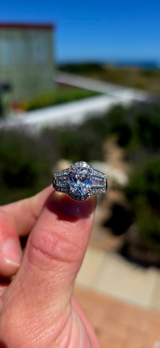 A beautifully crafted sterling silver statement dress ring, combining spectacular sparkle with elegant, Art Deco-inspired detailing.