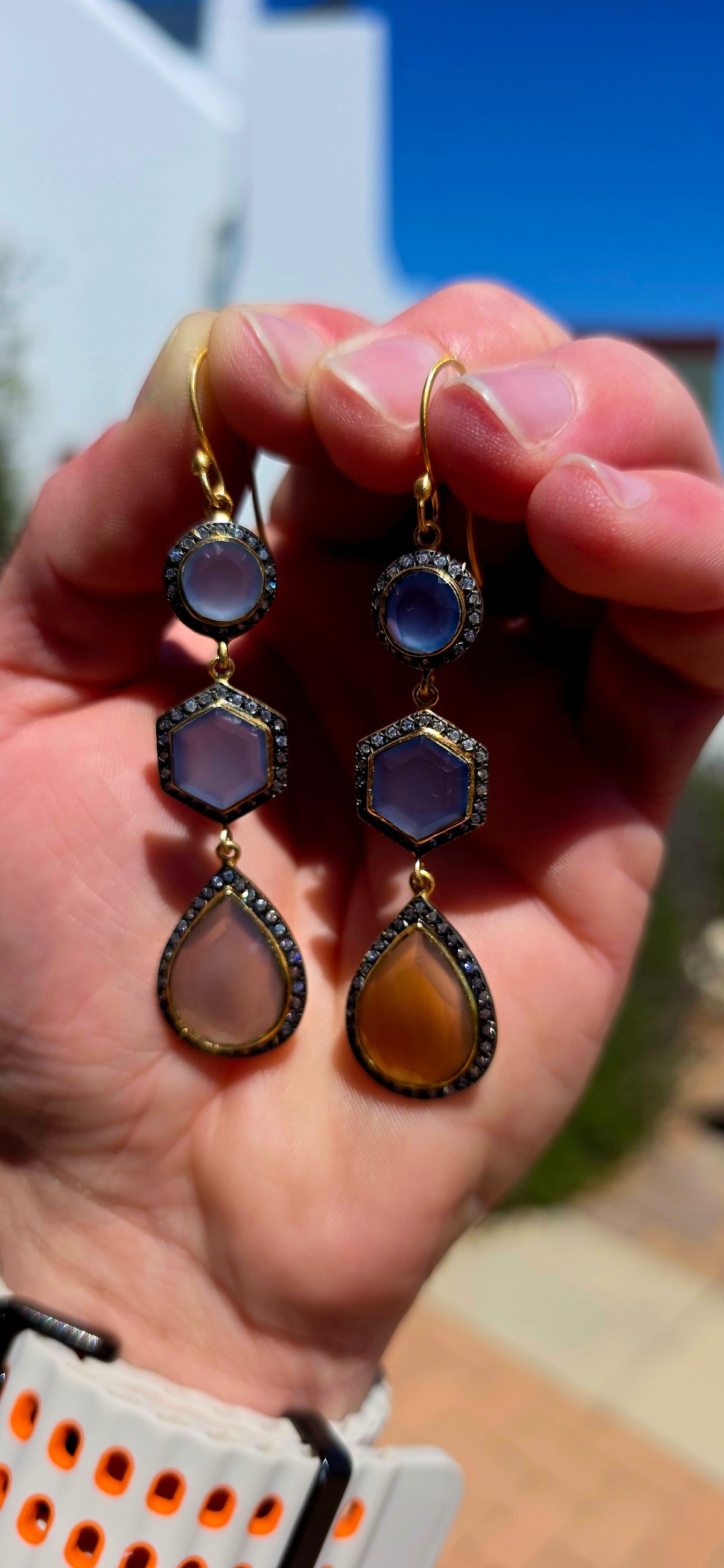 A magical pair of sterling silver drop earrings, beautifully finished in rich satin yellow gold plating and adorned with an exquisite combination of softly glowing chalcedony gemstones and sparkling cubic zirconia accents.