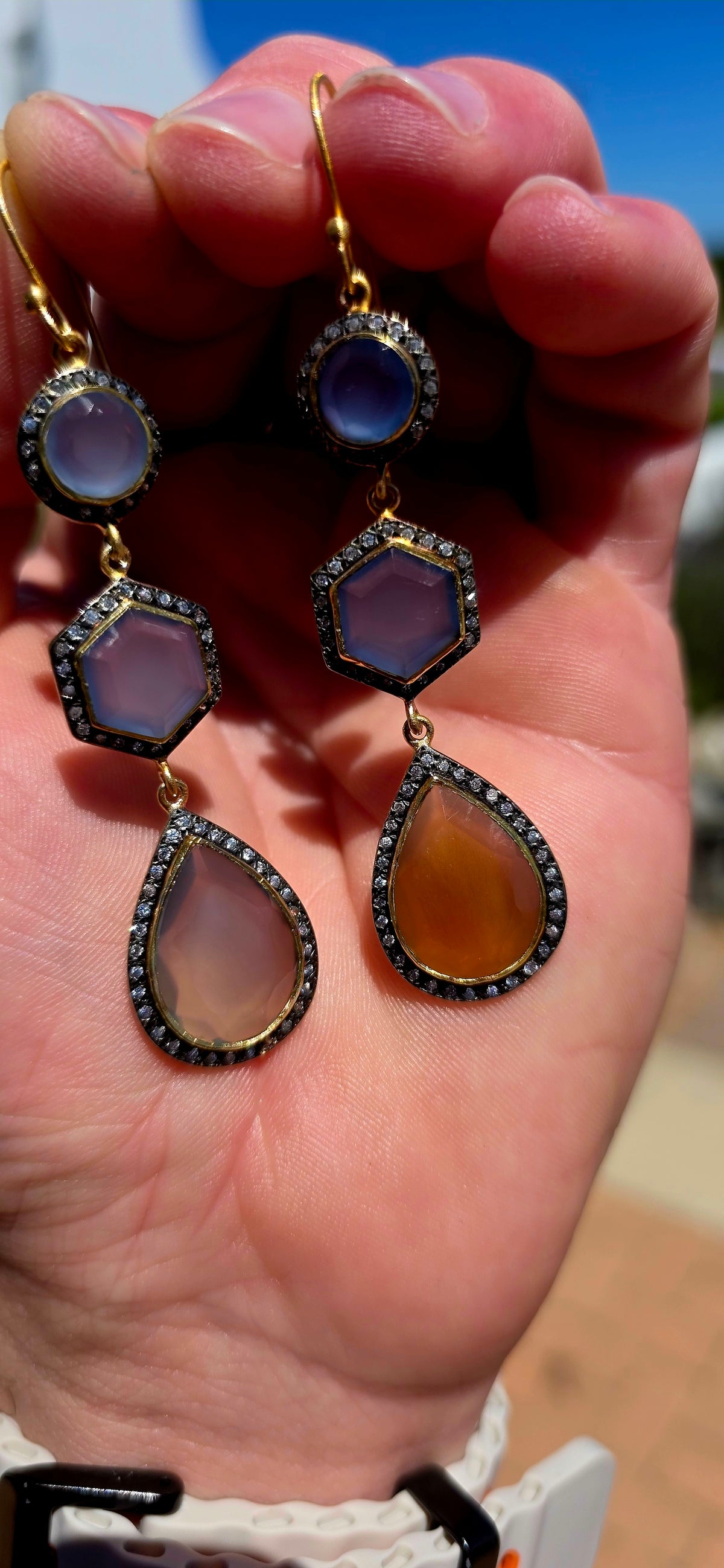 A magical pair of sterling silver drop earrings, beautifully finished in rich satin yellow gold plating and adorned with an exquisite combination of softly glowing chalcedony gemstones and sparkling cubic zirconia accents.