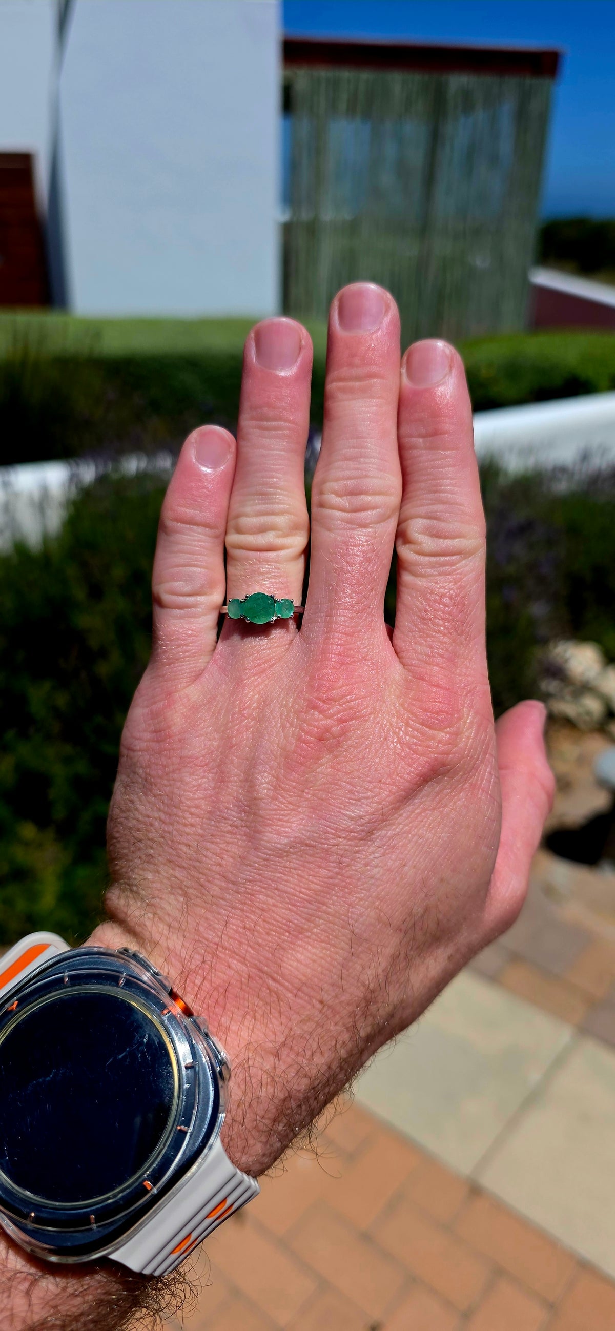 A wonderfully elegant sterling silver and emerald trilogy ring, featuring three gorgeous round-cut emerald gemstones in the most enchanting shades of green!