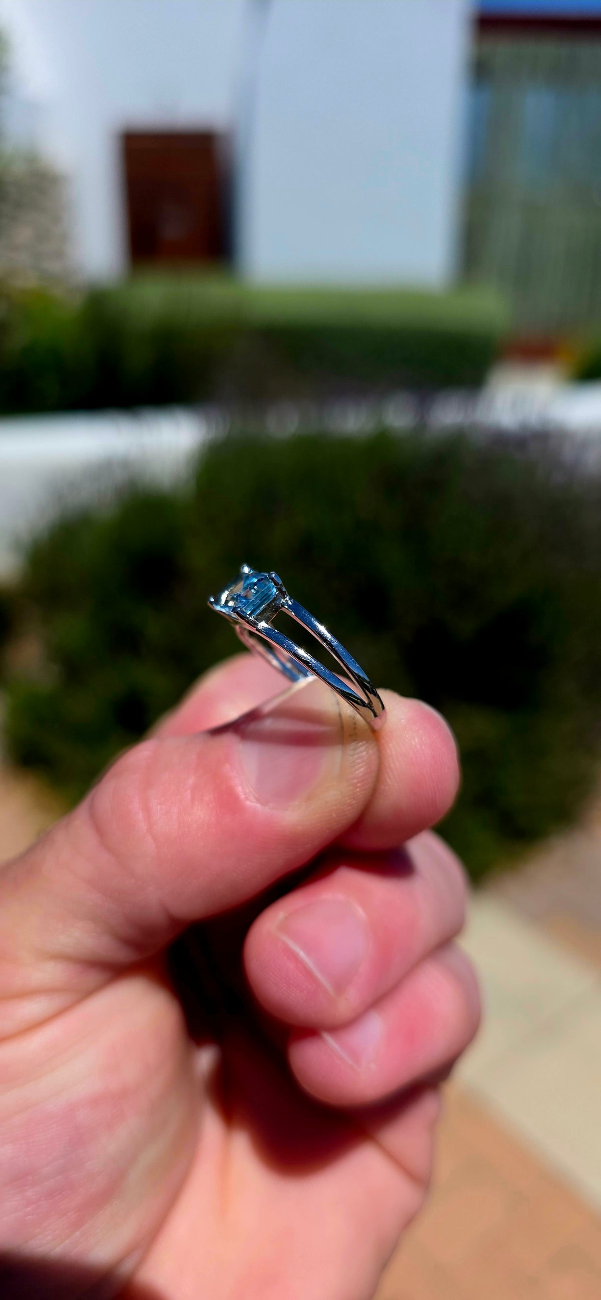 A wonderfully elegant sterling silver solitaire ring featuring a gorgeous emerald-cut sky blue topaz, beautifully showcased in a delicate, contemporary setting!