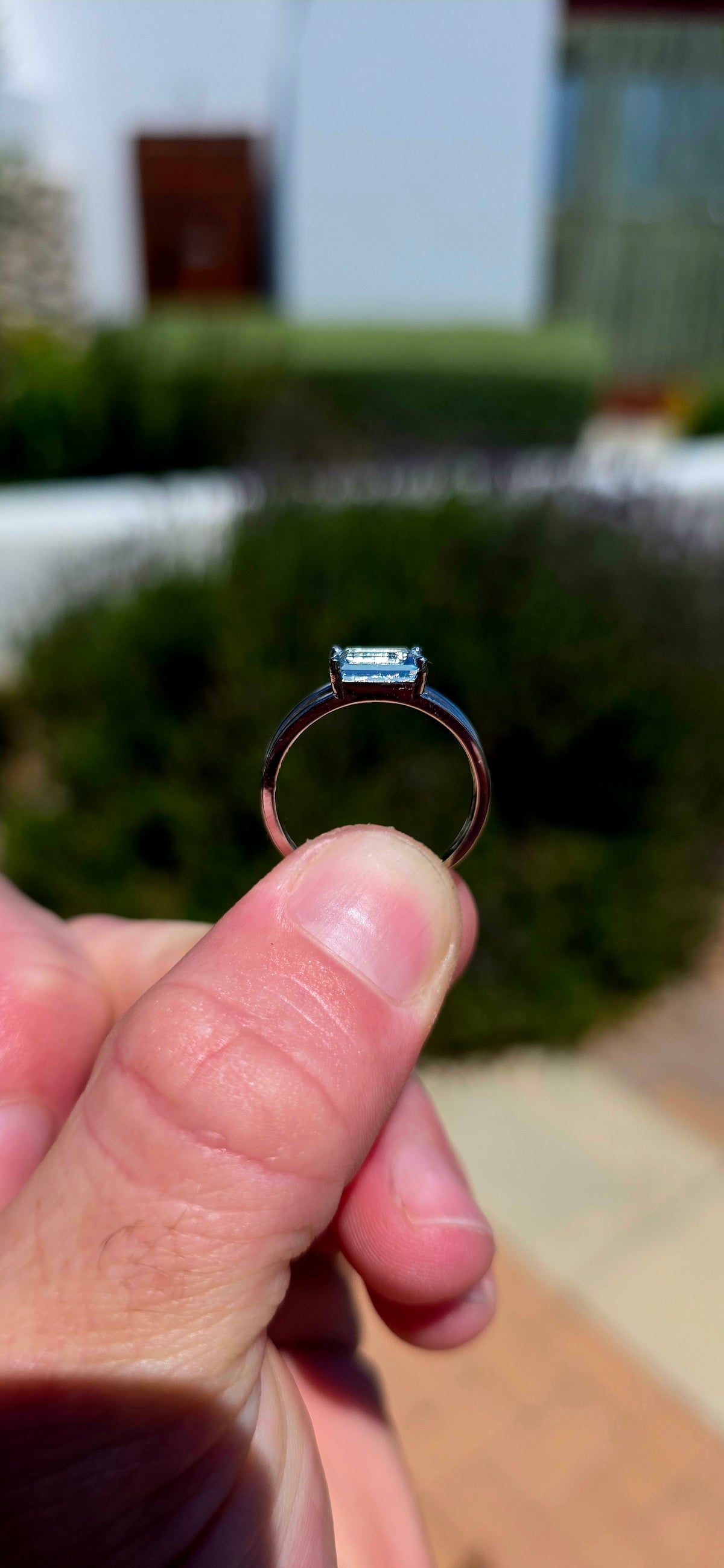 A wonderfully elegant sterling silver solitaire ring featuring a gorgeous emerald-cut sky blue topaz, beautifully showcased in a delicate, contemporary setting!