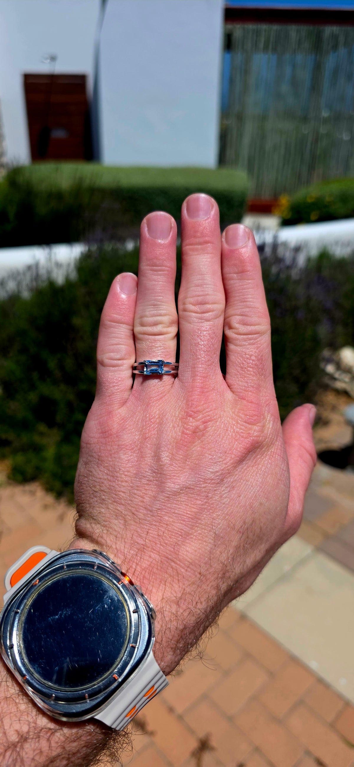 A wonderfully elegant sterling silver solitaire ring featuring a gorgeous emerald-cut sky blue topaz, beautifully showcased in a delicate, contemporary setting!