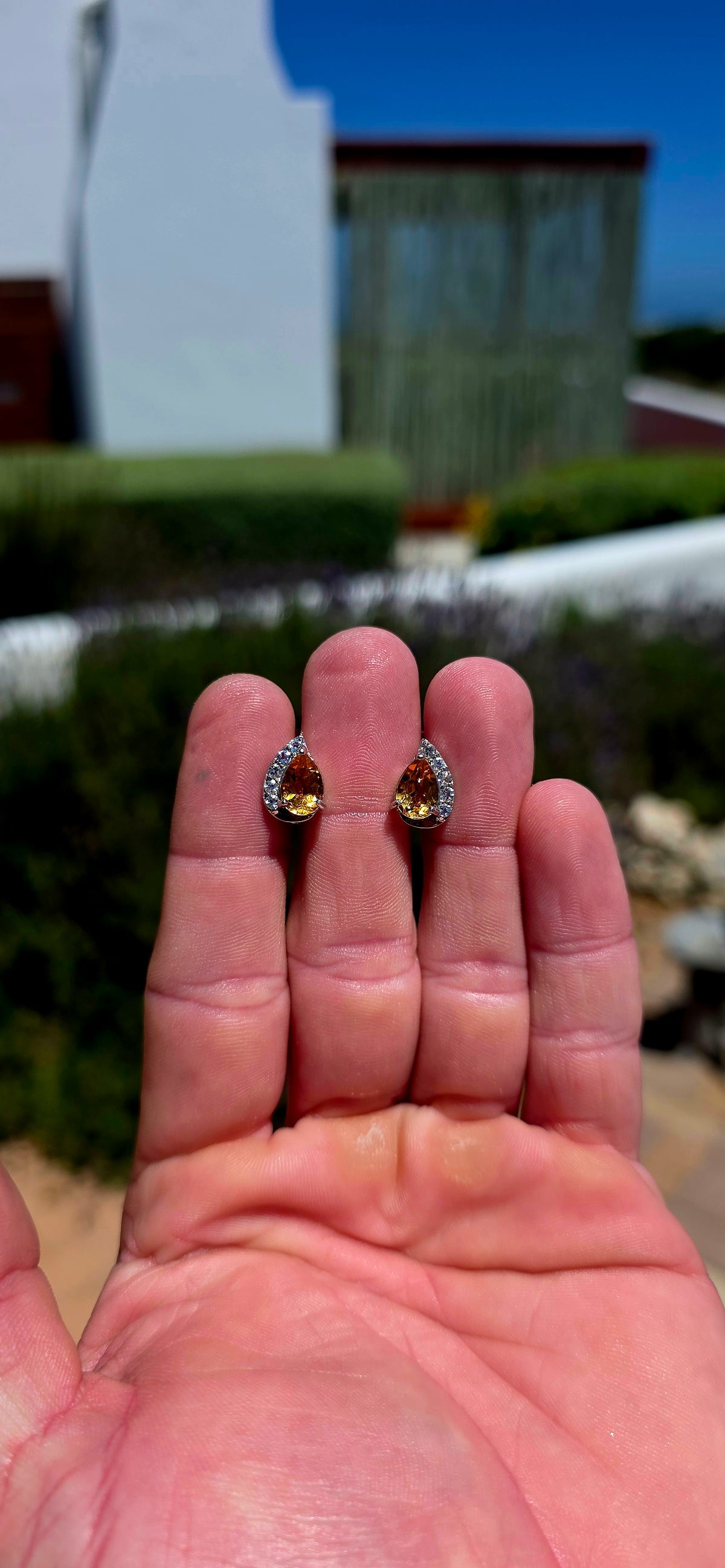 A wonderfully elegant pair of sterling silver earrings featuring the most beautiful golden-yellow citrine gemstones, surrounded by just the right amount of sparkle!
