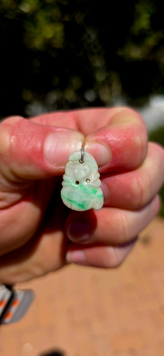 A delightful antique Chinese jade pendant, intricately hand-carved into a miniature fruit-inspired design, with the loveliest soft white colouring and beautiful natural splashes of vibrant apple green!