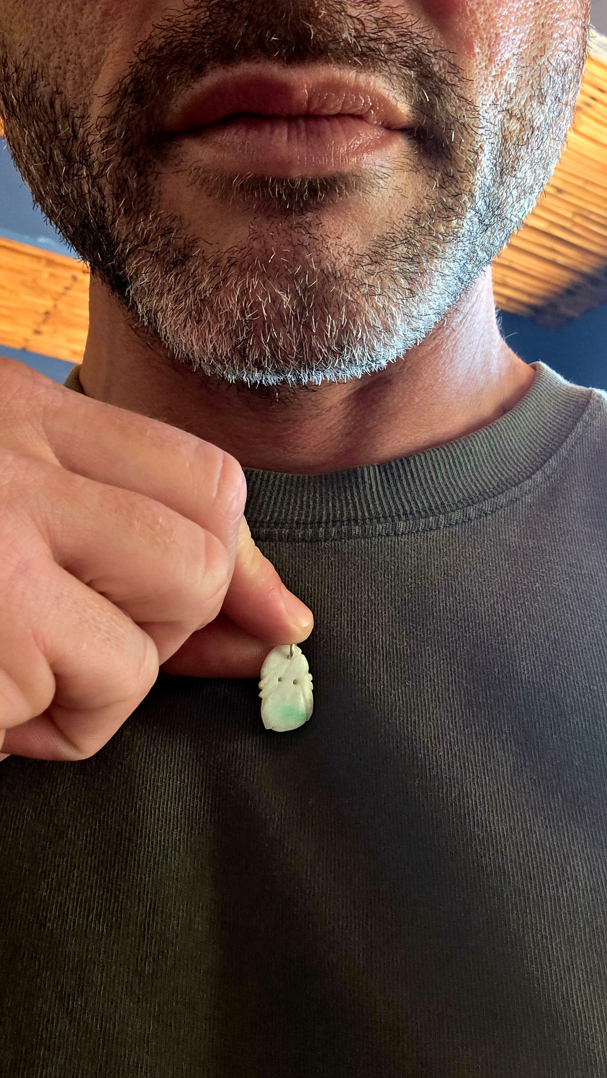A delightful antique Chinese jade pendant, intricately hand-carved into a miniature fruit-inspired design, with the loveliest soft white colouring and beautiful natural splashes of vibrant apple green!
