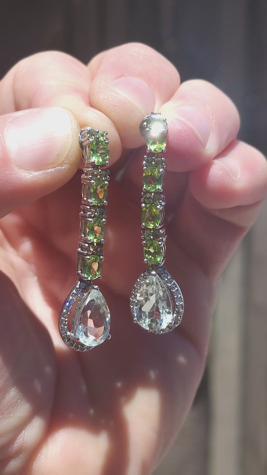 A glamorous pair of sterling silver articulated drop earrings designed to move with you — elegant, sparkly and seriously eye-catching.